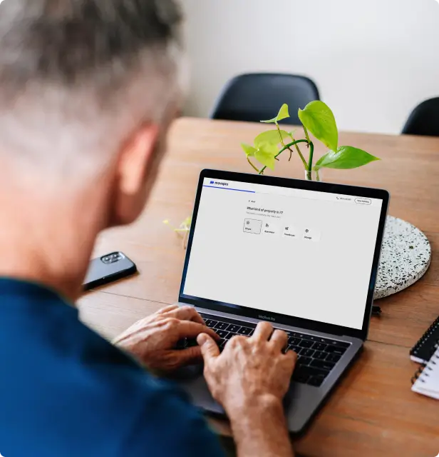Man on laptop booking online